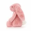 petit lapin rose aux grandes oreilles tombantes